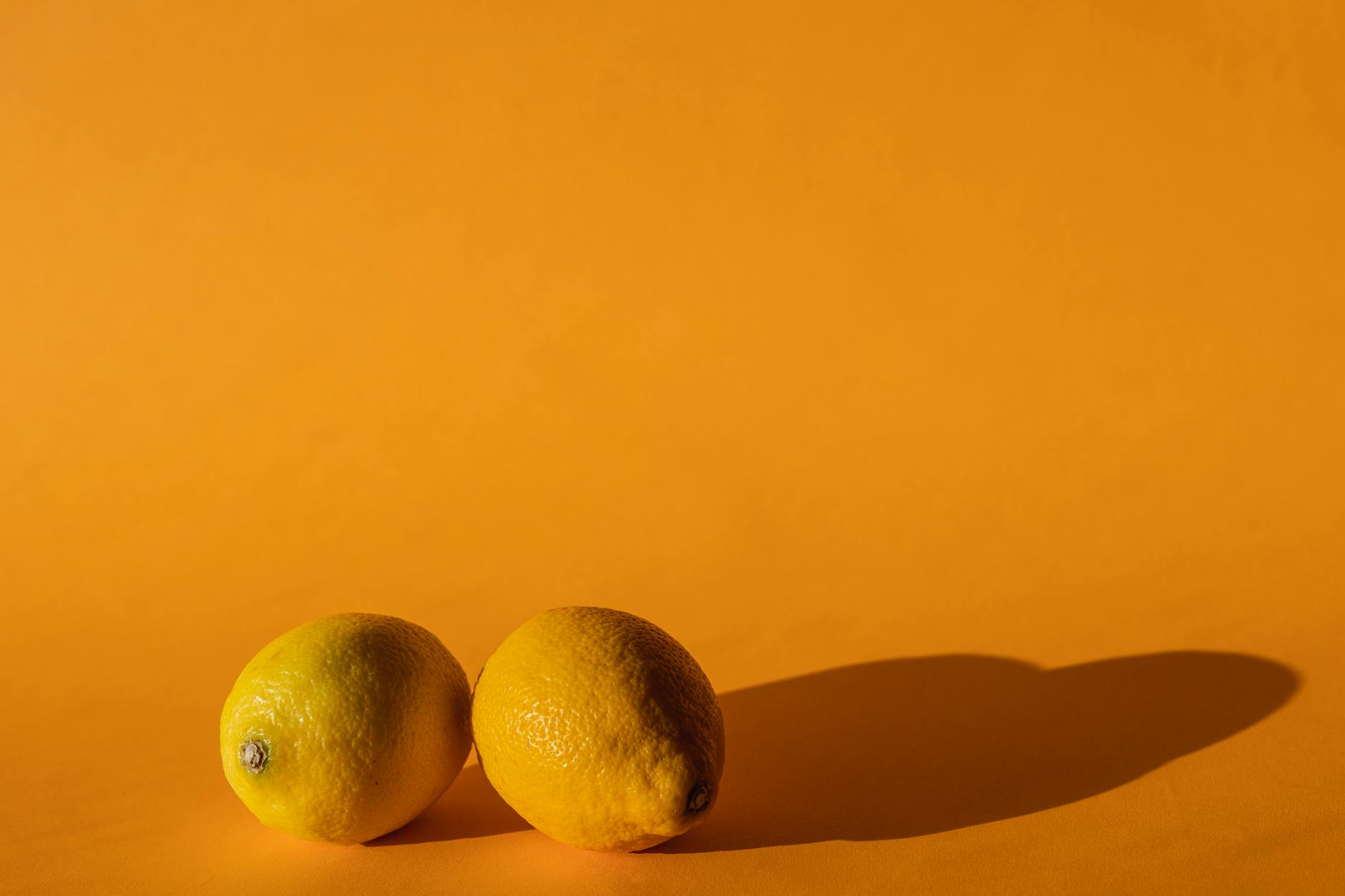 Bright yellow lemons arranged on a warm background, symbolizing rekindled closeness